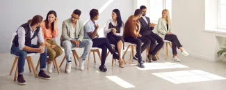 Adults practicing conversation in a language group (illustrative stock photograph)